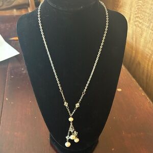 silver-tone necklace with rhinestone and clear beads and faux pearls